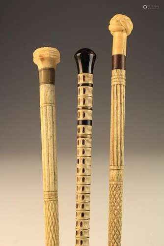 Three Fine 19th Century Walking Canes: Two of whale bone and marine ivory with elaborately carved