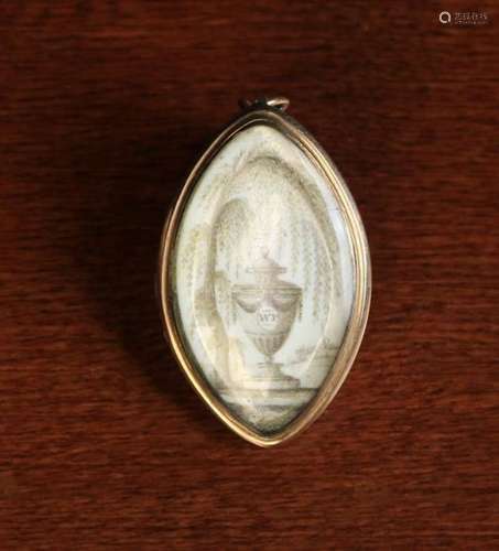 A Late 18th Century Navette Shaped Memorial Pendant meticulously painted in sepia with a pedestal