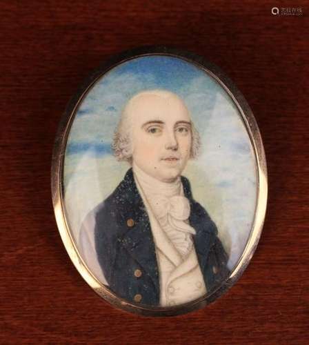 A Georgian Memorial Pendant inset with an oval miniature portrait painted on ivory of a gentleman,