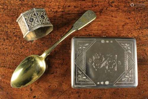 Three Pieces of Russian Silver: A 19th Century silver gilt dessert spoon decorated with foliate