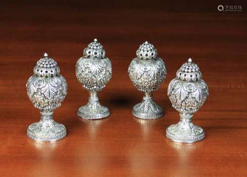 A Set of Four 19th Century Indian Silver Condiment Pots (A/F).