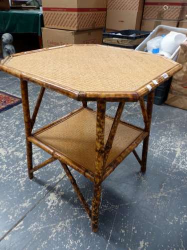 AN ANTIQUE BAMBOO TWO TIER OCCASIONAL TABLE TOGETHER WITH A LLOYD LOOM ARMCHAIR WITH SPRUNG SEAT. (