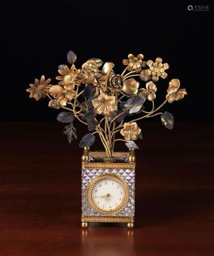 A Small Ornamental Cut Glass & Gilt Metal Clock with alarm.