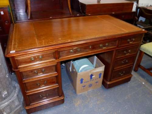 A VICTORIAN MAHOGANY TWIN PEDESTAL WRITING DESK WITH TOOLED BROWN LEATHER INSET TOP OVER NINE