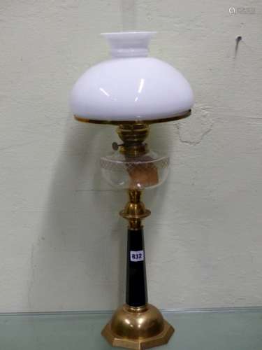A VICTORIAN ARTS MOVEMENT OIL LAMP WITH CUT GLASS FONT OVER BRASS AND BLACK GLASS OCTAGONAL