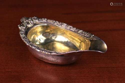 A George III Silver Gilt Pap Boat London 1812 with a shell crested handle and elaborately cast