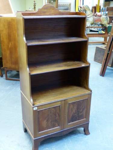 A 19th.C.AND LATER MAHOGANY WATERFALL SMALL BOOKCASE WITH PANEL DOORS TO TOP, BASE ON SPLAY