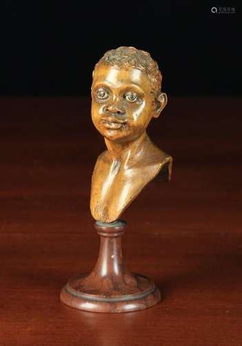 A Small Late 17th Century Sicilian Carved Boxwood Bust of a Blackamoor Boy,