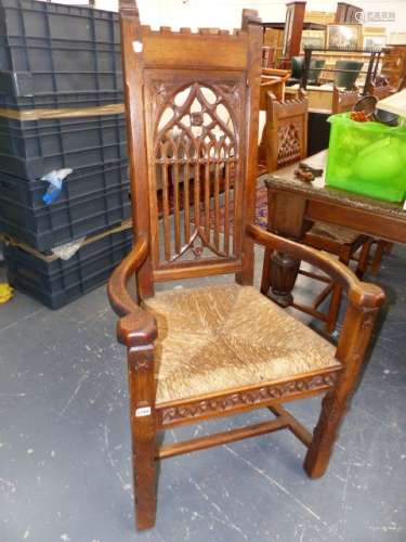 A SET OF SEVEN LATE 19th.C.OAK DINING CHAIRS WITH GOTHIC FRET PIERCED BACKS AND DROP IN RUSH