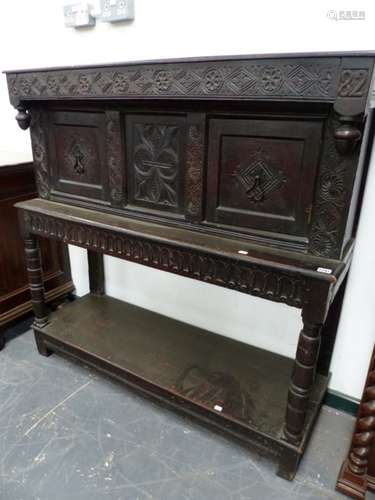 AN 18th/19th.C. OAK SIDE CABINET WITH TWO PANEL DOORS OVER CARVED CENTRAL FRIEZE AND POTBOARD