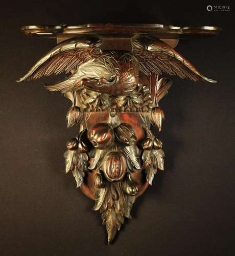 A Carved Black Forest Style Wall-mounted Shelf.