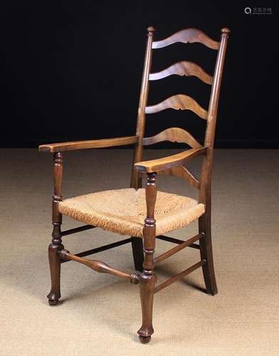 A Vintage Rush-seated Ladder-back Armchair.