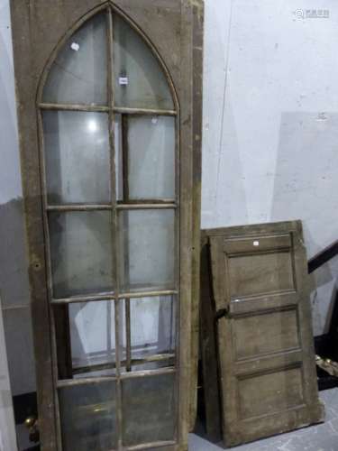 A PAIR OF PINE GOTHIC ARCH GLAZED PANEL DOORS, EACH 68 x 207cms. TOGETHER WITH THREE SECTIONS OF