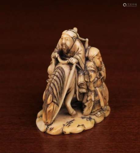 A Fine 19th Century Ivory Okimono carved in intricate detail with a Horse & Rider with Attendant by