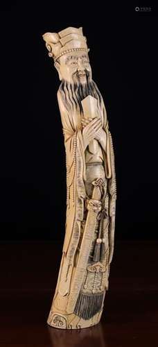 A Large Late 19th Century Meiji Period Ivory Carving of Sage Confucius wearing a layered head dress