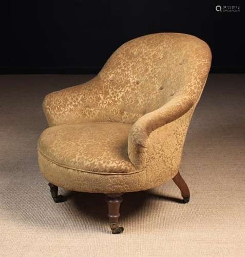 A Late Victorian Upholstered Tub Chair covered in a mustard coloured sculpted velvet fabric and