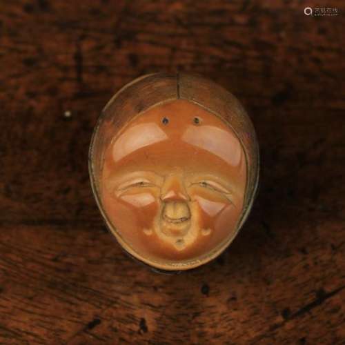 A Fine 19th Century Carved Corozo Nut Netsuke by Masaharu signed in a reserve to the back.