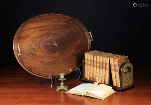 A 19th Century Mahogany Oval Gallery Tray with brass scroll handles and an inlaid compass star to