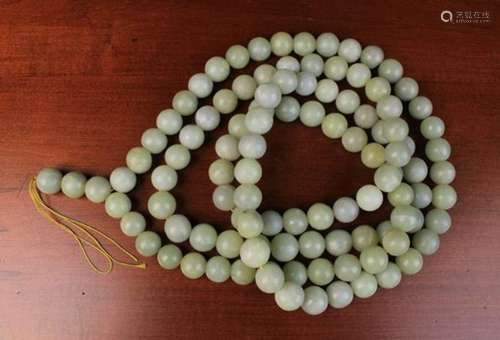 A Long String Necklace of Large turned Jade Beads 6ft 6