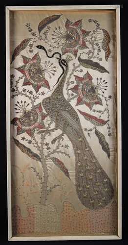 An Embroidered Stumpwork Panel depicting a peacock with serpent amidst flowering foliage worked in