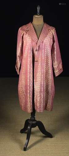 A Fine Vintage Hand-stitched Indian Coat woven with repeated gold botehs on a magenta ground and