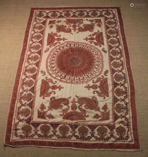 An Antique Indian Hand-made Table Cloth intricately embroidered predominantly in red enhanced with