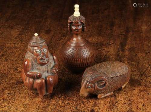 Three Pieces of Early 19th Century Treen: A coquilla nut carved as a crouching monkey wearing a