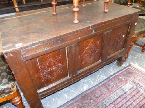 AN 18th.C.AND LATER OAK COFFER, CARVED PANEL FRONT WITH ASSOCIATED PLANK TOP. 115 x 55 x H.68cms.
