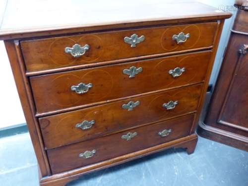 AN 18th.C. AND LATER WALNUT CHEST OF FOUR GRADED DRAWERS, EACH WITH LINE INLAID ROUNDELS ABOUT THE