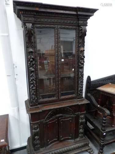 A 19th.C.ITALIAN WALNUT SIDE CABINET WITH GLAZED UPPER OVER CARVED INVERTED BOW FRONT DOORS, ON