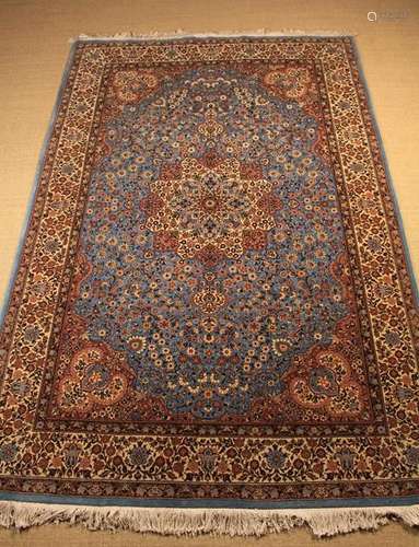 A Fine Late 20th Century Persian Carpet woven with a profusions of flowers surrounding a central