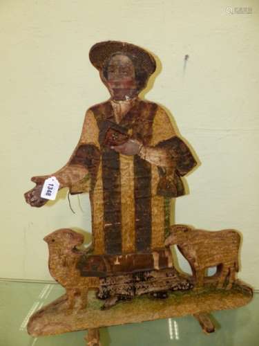 A PAINTED SILK WORK DUMMY BOARD OF A PREACHER WITH TWO SHEEP. H 63cms. TOGETHER WITH A GILT METAL