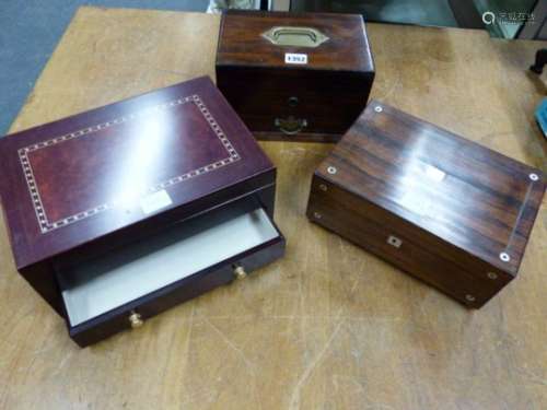 TWO ROSEWOOD JEWELLERY BOXES AND ANOTHER MAHOGANY, EACH WITH INTERIOR TRAY, ONE OF THE FORMER WITH
