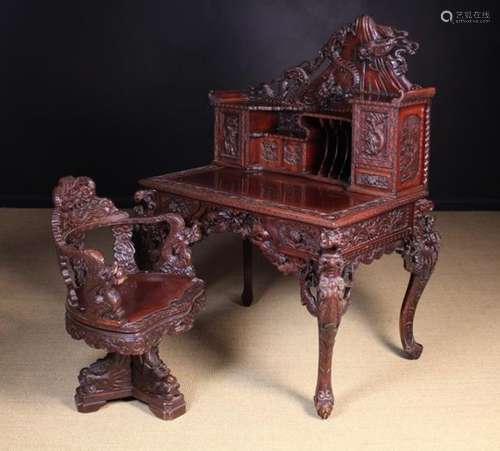 An Elaborately Carved Japanese Lacquered Desk & Chair (Reputedly winner of a 1910 competition in