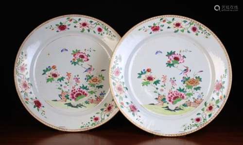 A Pair of Late 18th Century Famille Rose Chargers decorated with tree peonies in a trellis fenced