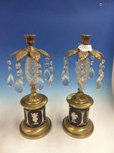 A PAIR OF LUSTRE CANDLESTICKS WITH DIAMOND HATCHED GLASS SPINDLE COLUMNS, FOLIATE SOCLES ABOVE BLACK