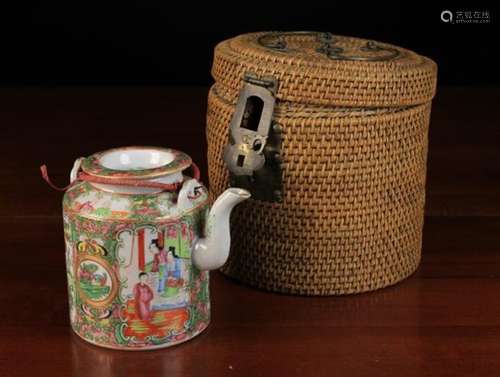 A Cantonese Teapot fitted in an insulated travelling basket.