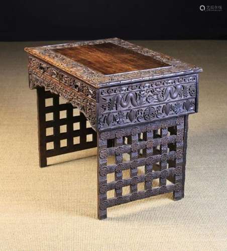 A Late 19th/Early 20th Century Chinese Carved Hardwood Folding Desk.