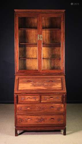 A 20th Century Carved Chinese Bureau Bookcase.