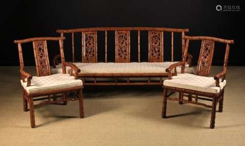 A 20th Century Chinese Three Piece Suite comprising of a Settee & Two Armchairs carved from