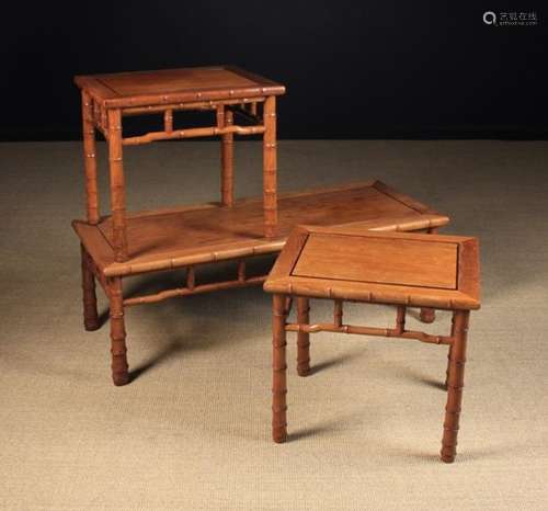 A 20th Century Chinese Carved Hardwood Coffee Table and a Pair of Matching Lamp/ Side Tables