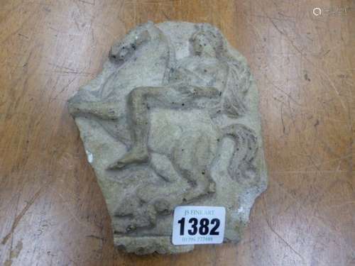 A MOULDED RELIEF OF AN HELLENISTIC SOLDIER ON A REARING HORSE. H 18cms.