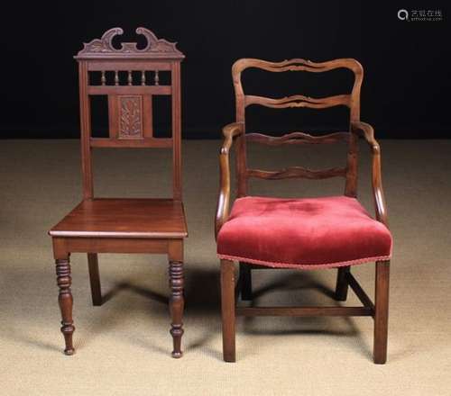 Two Chairs: A Late Victorian hall chair with a crested top rail above row of turned spindles and