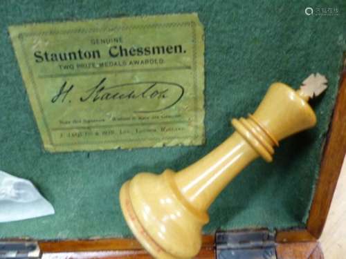 A MAHOGANY BOXED JACQUES STAUNTON CHESS SET IN BOX AND EBONY, THE WEIGHTED KINGS. H 10cms