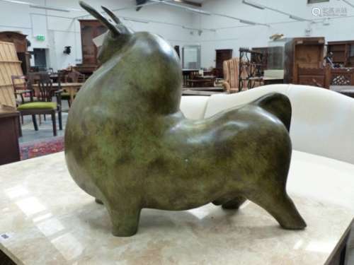 A LARGE VERDIGRIS PATINATED BRONZE FIGURE OF A STYLISED BULL. L.56cms.
