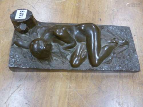 A COLD CAST BRONZE NUDE RECLINING ON A SHEET BY A TREE STUMP, BEARS SIGNATURE R
