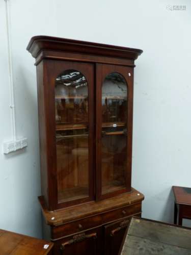 A VICTORIAN MAHOGANY GLAZED TOP BOOKCASE WITH TWO DRAWERS AND PANEL BASE DOORS ON PLINTH BASE. 95