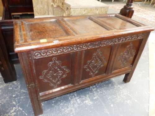 A GOOD 17th.C.OAK PANEL COFFER WITH CARVED AND DATED 1675 FRIEZE OVER THREE CARVED FRONT PANELS,