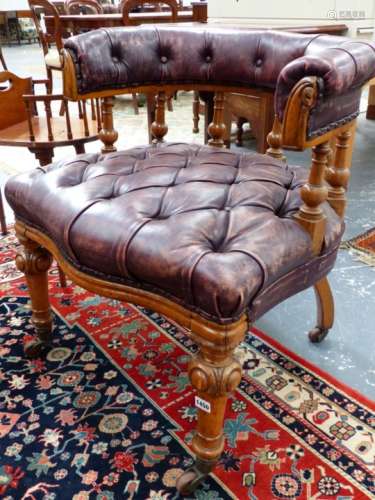 A VICTORIAN OAK FRAMED CAPTAIN'S DESK CHAIR WITH BROAD BUTTON LEATHER SEAT AND HORSESHOE BACK. 68 68