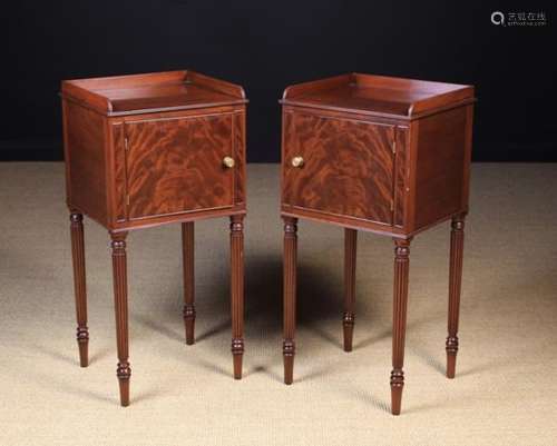 A Pair of Fine Quality George III Style Mahogany Bedside Cabinets having flame veneered doors and